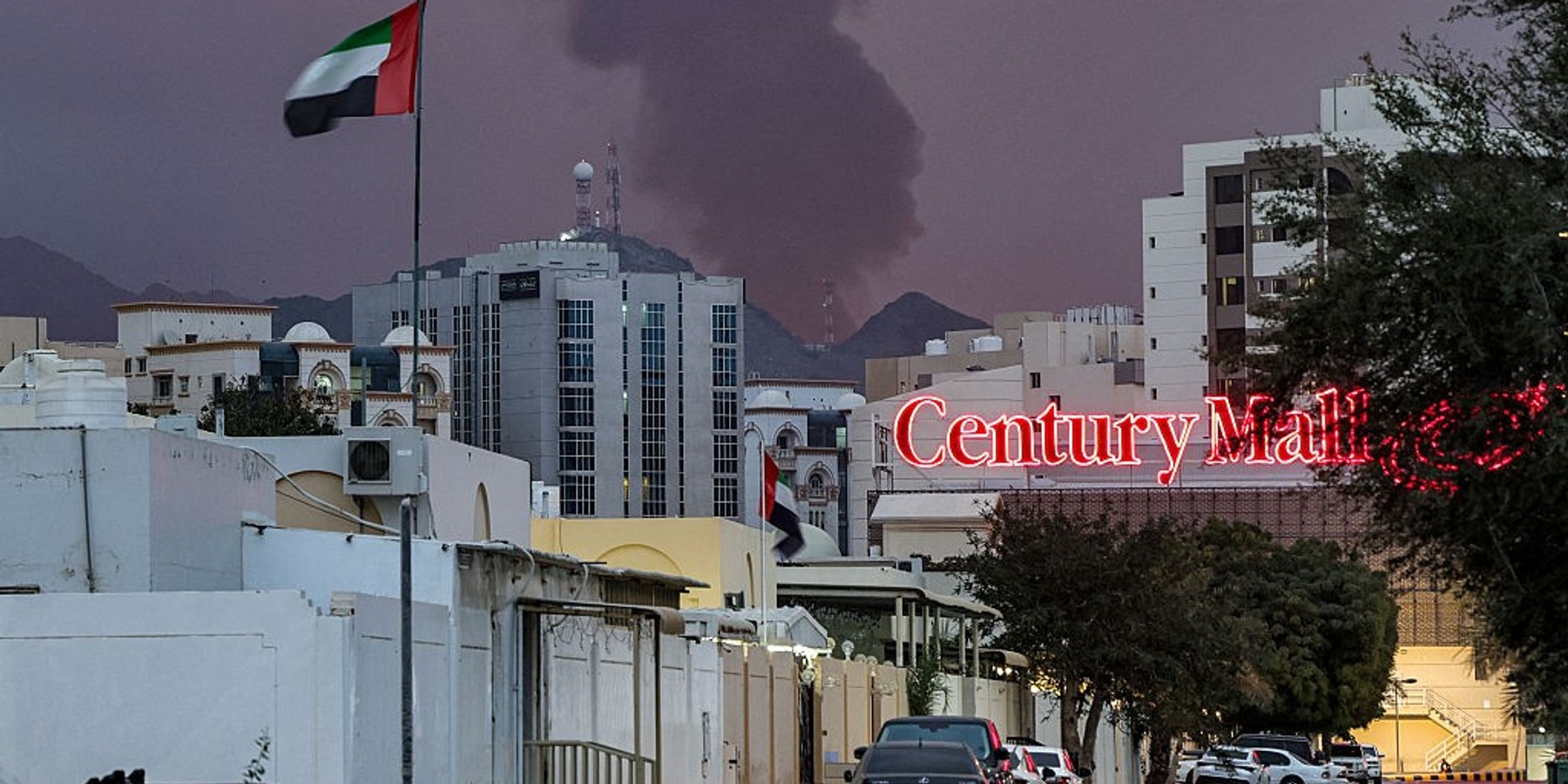 A plume of black smoke rises from the port of Fujairah in the gulf emirate of Fujairah on March 4, 2026. Iran's strikes on Gulf neighbours since February 28, following the US-Israeli attack, forced the UAE to shut its airspace, blindsiding travellers who thought they were headed to one of the region's safest holiday destinations. (Photo by Fadel SENNA / AFP via Getty Images)