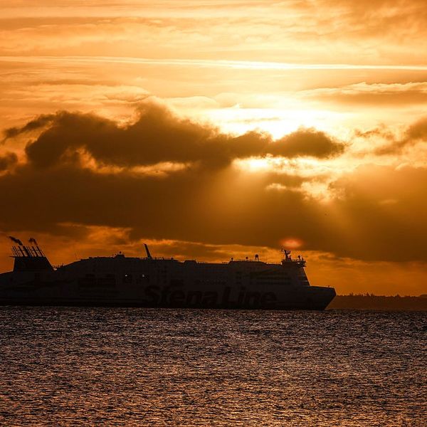 A ship crosses the Baltic Sea at sunrise
