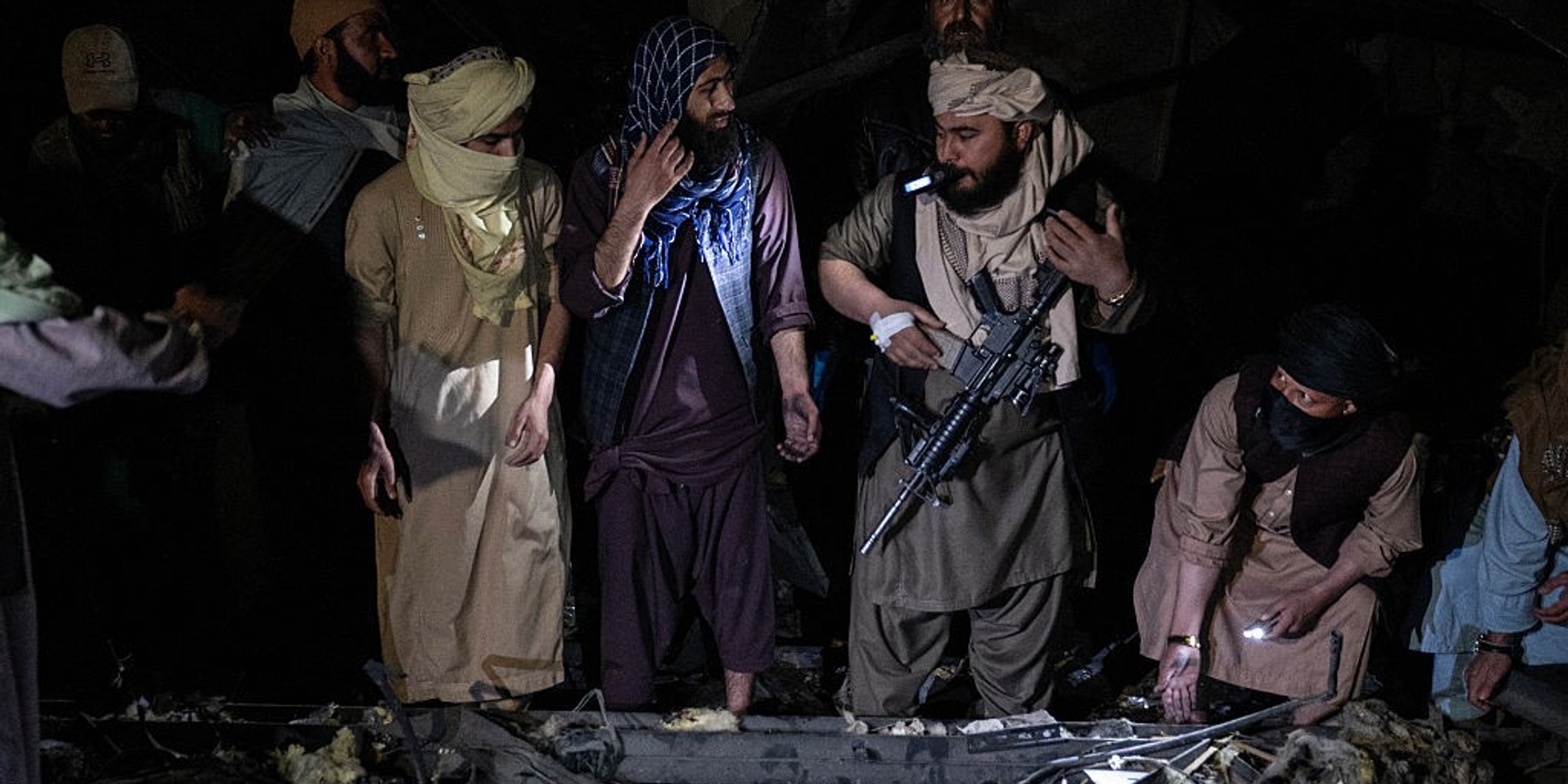 Afghan rescue teams and Taliban security personnel search for bodies under the rubble of a damaged building after an airstrike hit the Secondary Rehabilitation Services, in Kabul on March 16, 2026. Heavy casualties were feared on Tuesday after Afghanistan accused Pakistan of hitting a treatment centre for drug addicts in the capital, Kabul, and killing civilians. Pakistan denied deliberately targeting the facility, instead saying it had conducted precision strikes on "military installations and terrorist support infrastructure". The Pakistani military has struck Kabul several times in recent weeks, as part of a conflict sparked by claims that the Taliban government has harboured extremists who have carried out attacks across the border. (Photo by Wakil KOHSAR / AFP via Getty Images)