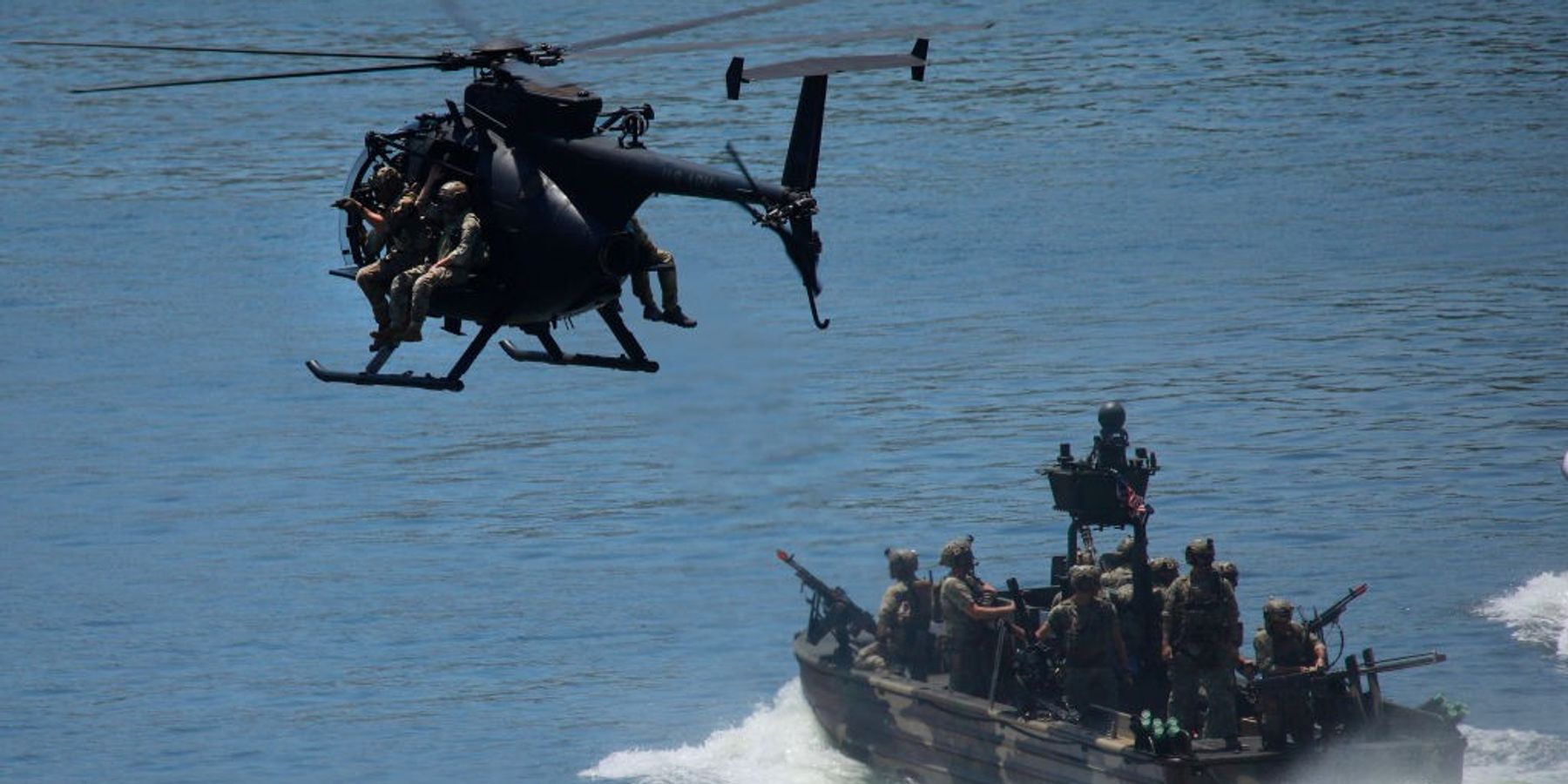 An MH-6 Little Bird helicopter, piloted by members of the U.S. Army's 160th Special Operations Aviation Regiment (SOAR), flies overhead during a capabilities demonstration at Special Operations Forces (SOF) Week at the Tampa Convention Center on May 8, 2024 in Tampa, Florida.
