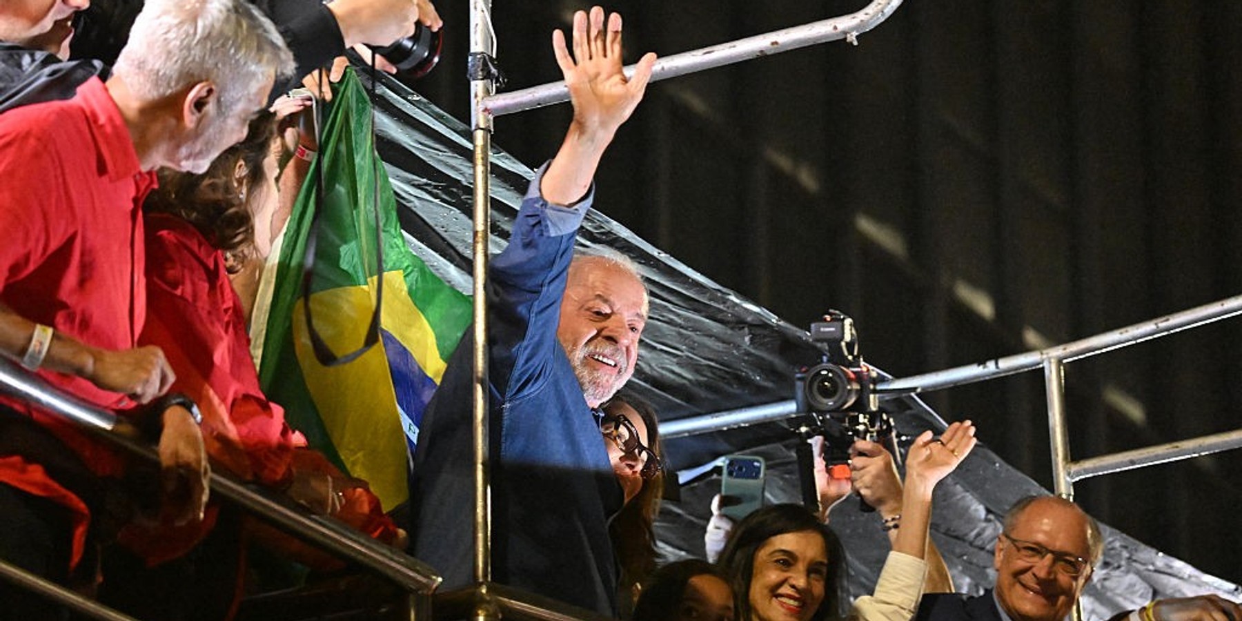 BRAZIL-ELECTION-RUNOFF-VOTE-SUPPORTERS Brazil's President and presidential candidate Luiz Inacio Lula da Silva gestures to supporters after winning the presidential runoff election in Sao Paulo, Brazil, on October 26, 2026. Lula da Silva pulled off a dramatic comeback on October 25, 2026, as he clinched election victory against right-wing senator Flavio Bolsonaro, who trounced him in the first round. (Photo by Juan BARRETO / AFP via Getty Images)