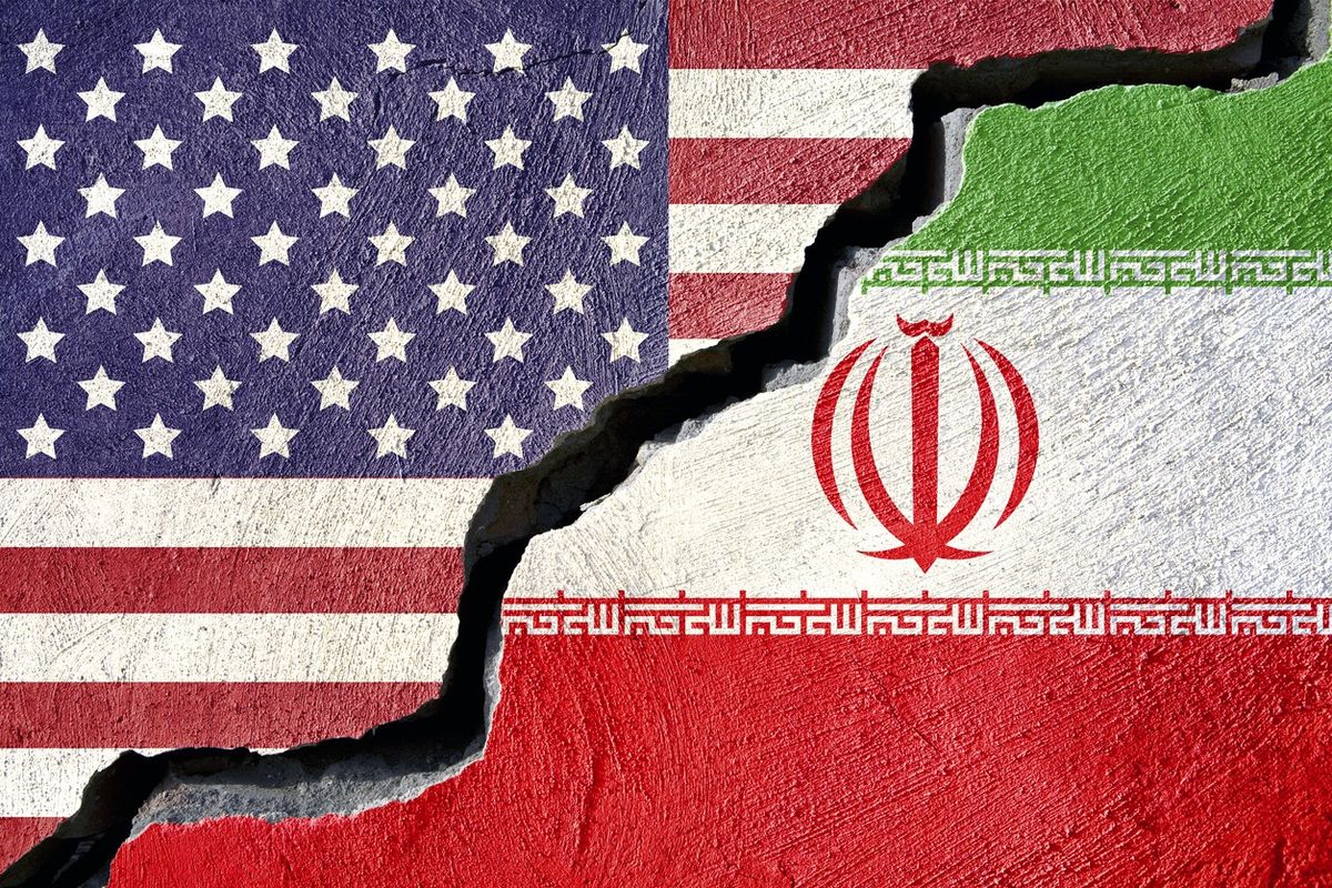 <p>Concept american and Iran flag on cracked background</p>