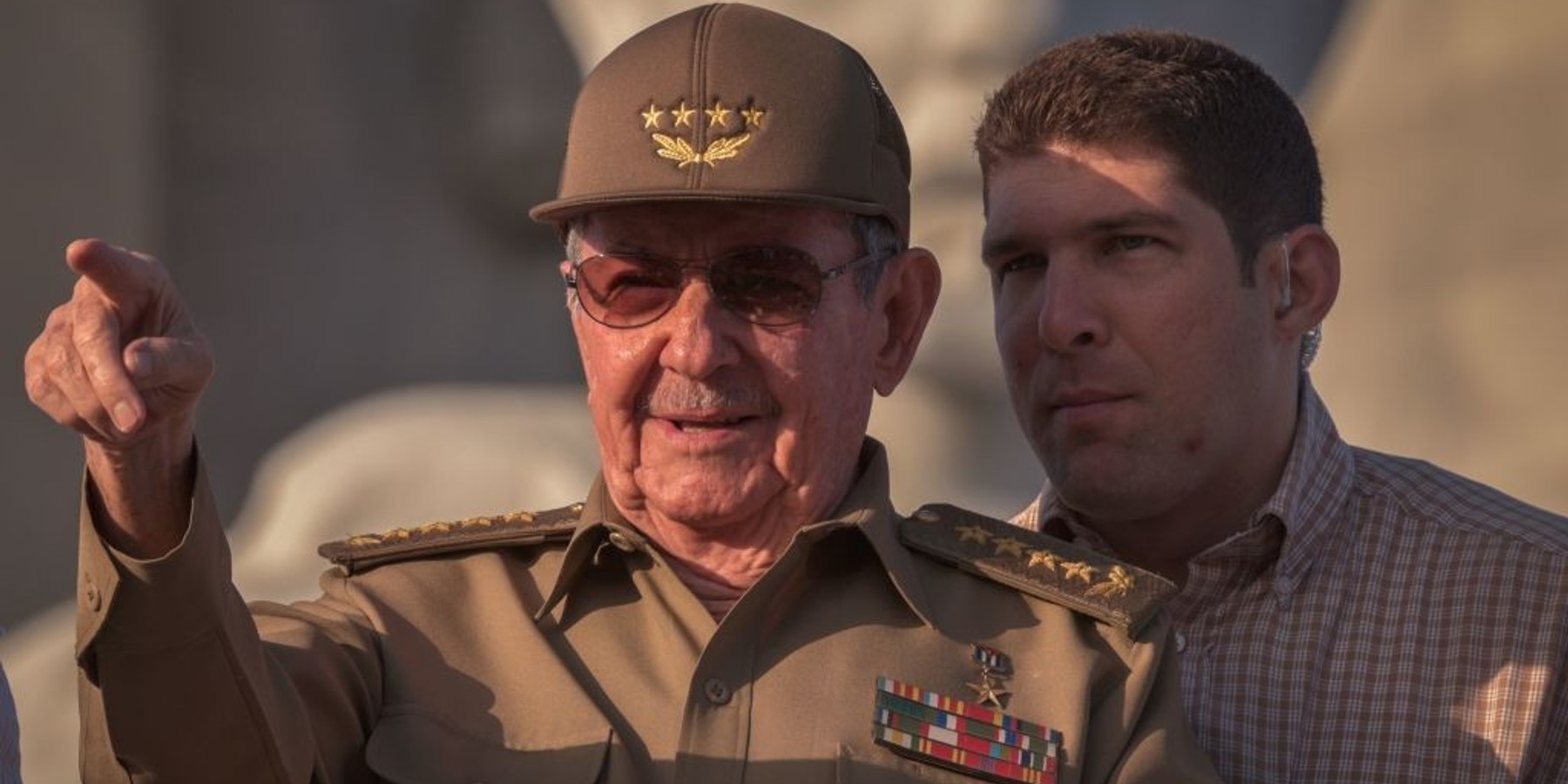 Cuban President Raul Castro, next to his grandson and bodyguard, Raul Rodriguez Castro, attends the May Day parade at Revolution Square of Havana, on May 1, 2017. At left, / AFP PHOTO / ADALBERTO ROQUE (Photo credit should read ADALBERTO ROQUE/AFP via Getty Images)