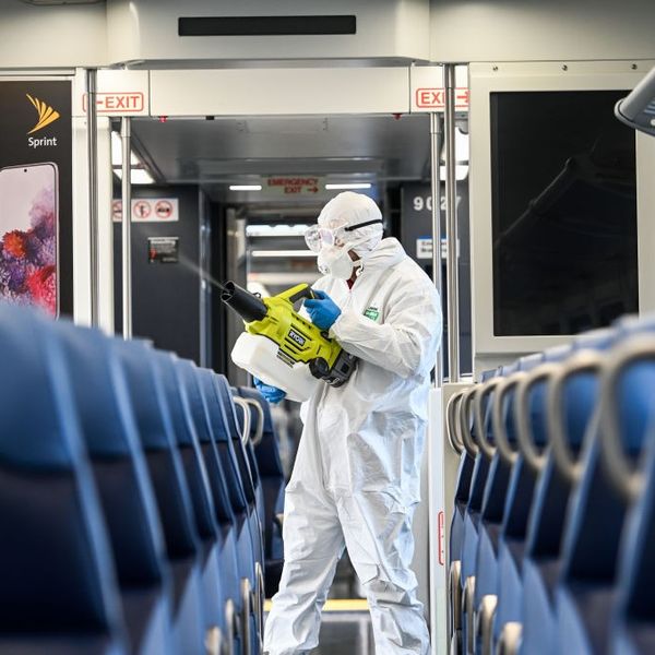 Hicksville, N.Y.: A Long Island Rail Road employee disinfects a train car with an eco-friendly cleaner while at the Hicksville, New York LIRR station on March 19, 2020.