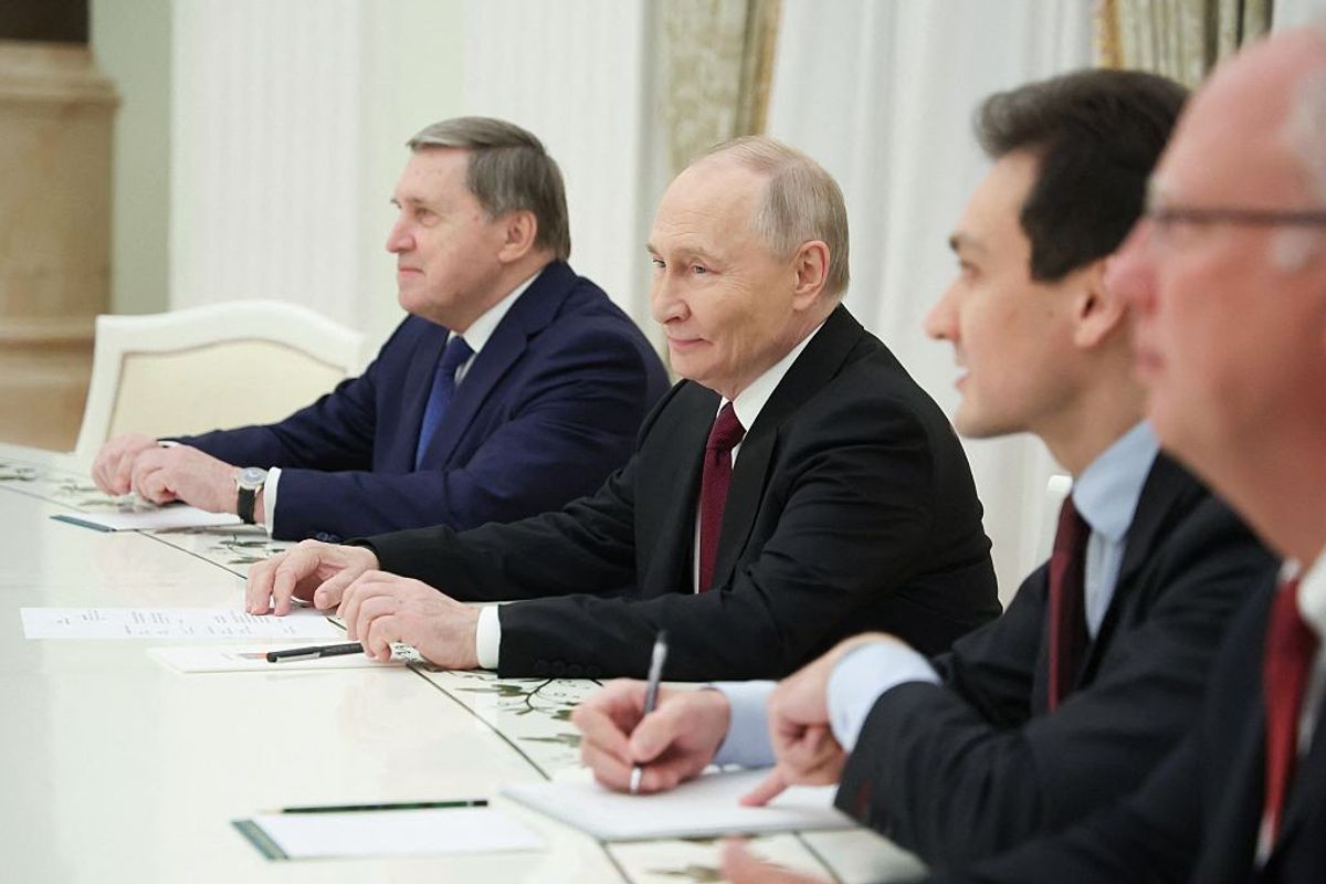 In this pool photograph distributed by the Russian state agency Sputnik, Russia's President Vladimir Putin attends a meeting with US special envoy Steve Witkoff and US President Donald Trump's son-in-law Jared Kushner (both not pictured) at the Kremlin in Moscow on December 2, 2025.