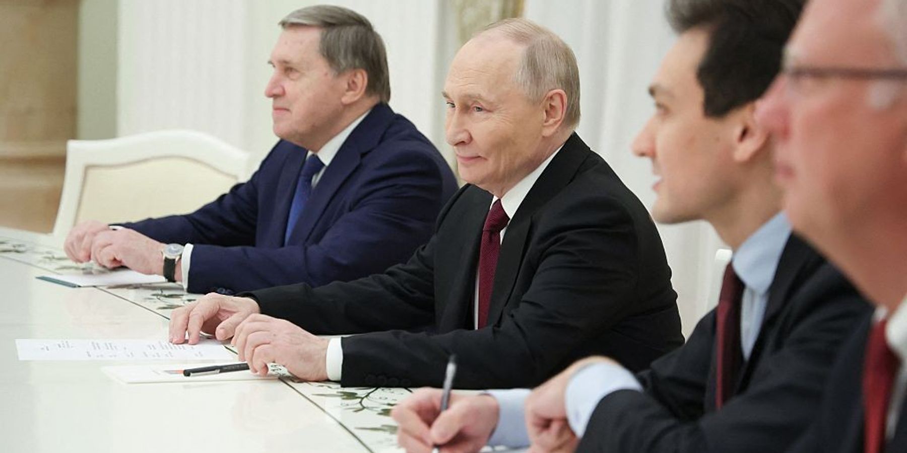 In this pool photograph distributed by the Russian state agency Sputnik, Russia's President Vladimir Putin attends a meeting with US special envoy Steve Witkoff and US President Donald Trump's son-in-law Jared Kushner (both not pictured) at the Kremlin in Moscow on December 2, 2025.