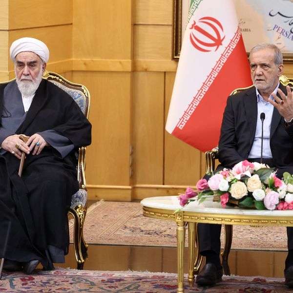 Iranian President Masoud Pezeshkian (R) speaks during a press conference after arriving at Mehrabad Airport in Tehran, Iran on September 27, 2025