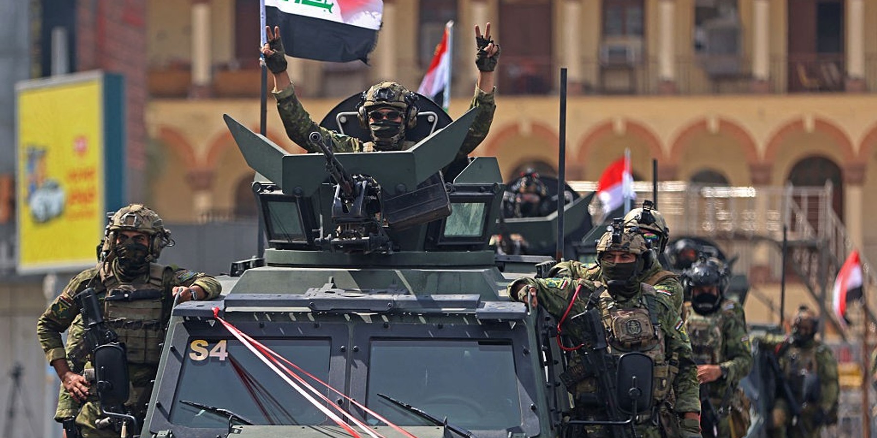 IRAQ-IRAN-US-CONFLICT A member of the Iraqi security forces, flashes the victory sign during a military parade marking the withdrawal of the US-led coalition from Iraq, in Baghdad on September 30, 2026. A US-led coalition deployed in Iraq more than a decade ago to fight jihadists concluded its mission on September 30, a move celebrated by the country's leaders, but which some fear will embolden pro-Iran armed factions. (Photo by AHMAD AL-RUBAYE / AFP via Getty Images)