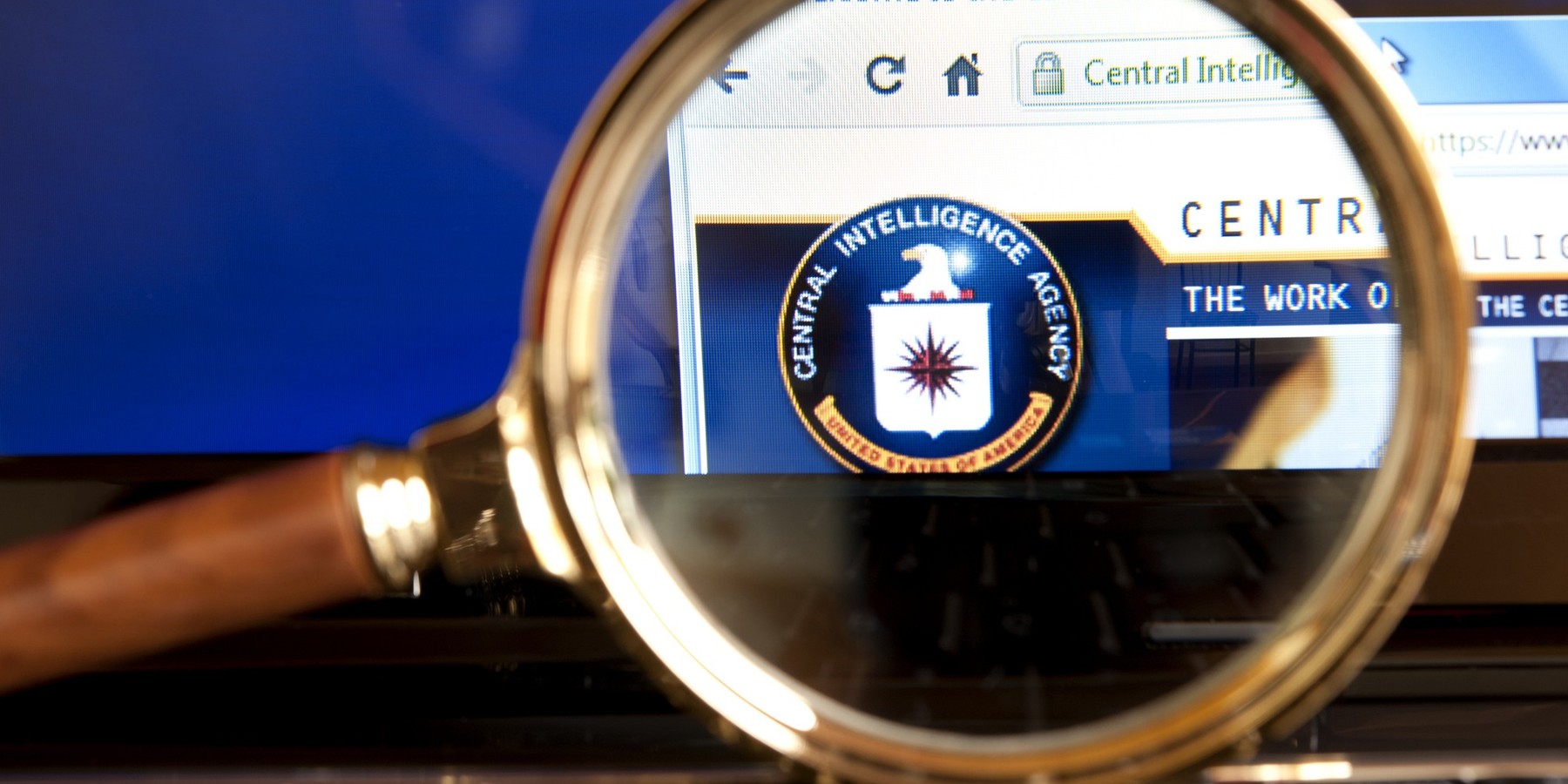 "Izmir, Turkey - June 12, 2012: Close up to CIA(Central Intelligence Agency) website through a magnifying glass on the laptop. The CIA is an independent agency responsible for providing national security intelligence to senior US policymakers."