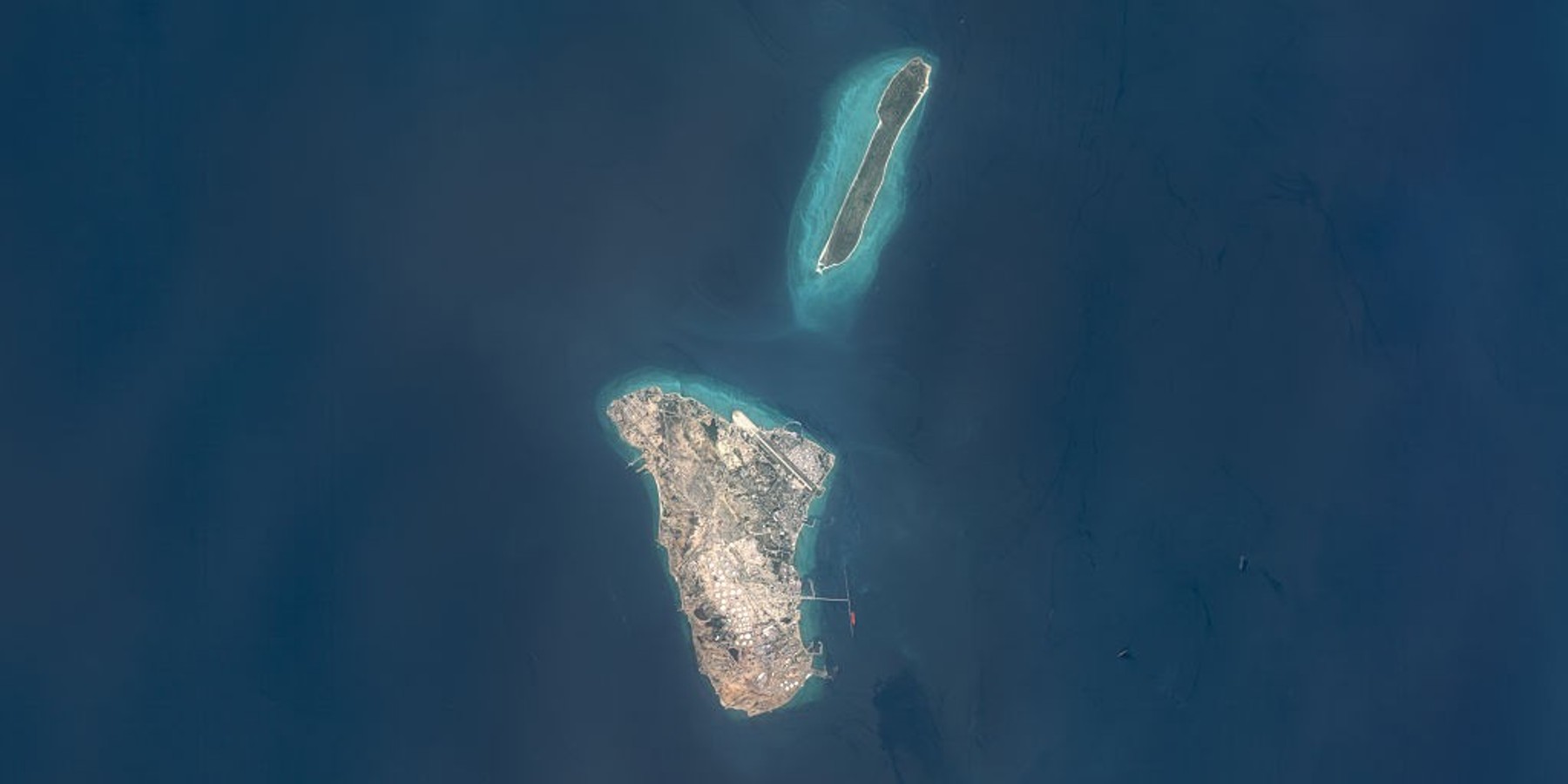 Kharg Island/Iran April 6, 2026 KHARG ISLAND, IRAN -- APRIL 6, 2026: Maps4Media processed and enhanced Sentinal-2 satellite imagery shows Kharg Island and nearby Khargu Island in the Persian Gulf, including visible storage tank arrays, an airstrip, port infrastructure, and surrounding shallow-water zones. The image documents major industrial and maritime facilities on one of Iran's most strategically significant offshore islands. Please use: Satellite image (c) 2026 Maps4media. (Photo enhanced and published by maps4media via Getty Images)