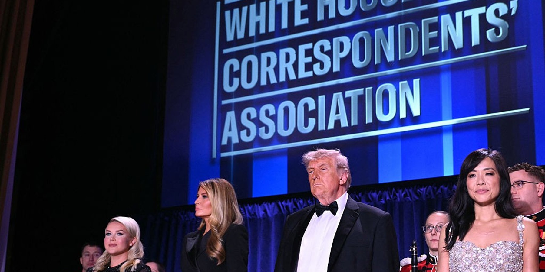 (L/R) US First Lady Melania Trump, US President Donald Trump and CBS News senior White House correspondent Weijia Jiang attend the White House Correspondents' dinner at the Washington Hilton in Washington, DC, on April 25, 2026. President Trump is attending the annual gala of the political press for the first time while in office. (Photo by Mandel NGAN / AFP via Getty Images)