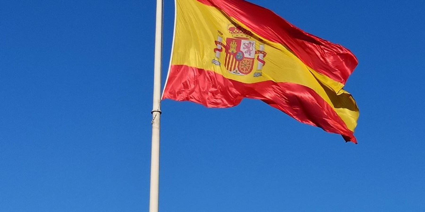 MADRID, SPAIN - APRIL 2026: Spanish flag in Plaza de Colon ( Columbus Square ) , the largest flag raised in Spain on April 1, 2026 in Madrid, Spain. (Photo by Cristina Arias/Cover/Getty Images)