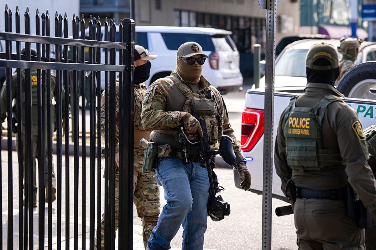 Members of US Immigration and Customs Enforcement (ICE) and US Customs and Border Patrol (CBP) patrol near a Lowe's hardware store in New Orleans, Louisiana, on December 3, 2025.