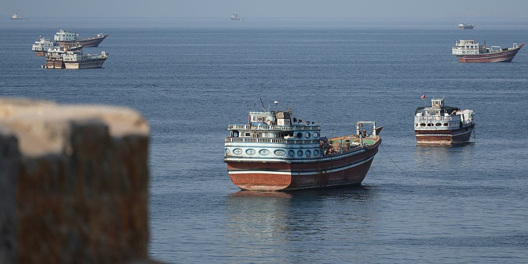 OMAN-IRAN-US-ISRAEL-WAR Ships are anchored off the coast of Khasab in Oman's Musandam Governorate, near the Strait of Hormuz, on October 2, 2026. (Photo by AFP via Getty Images)