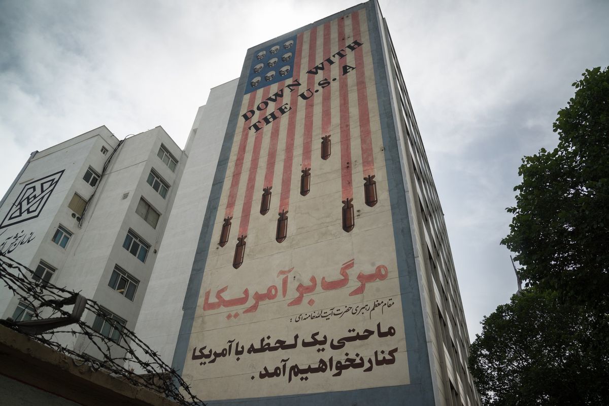 Propaganda paintings with american flag an "Down with the USA text" in Tehran, Iran - stock photo