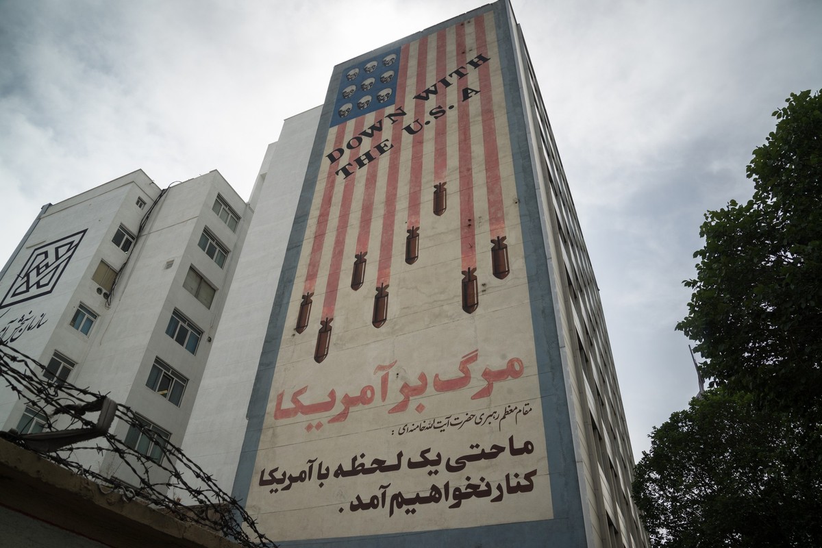 Propaganda paintings with american flag an "Down with the USA text" in Tehran, Iran - stock photo