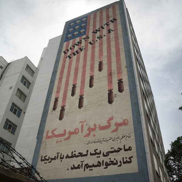 Propaganda paintings with american flag an "Down with the USA text" in Tehran, Iran - stock photo