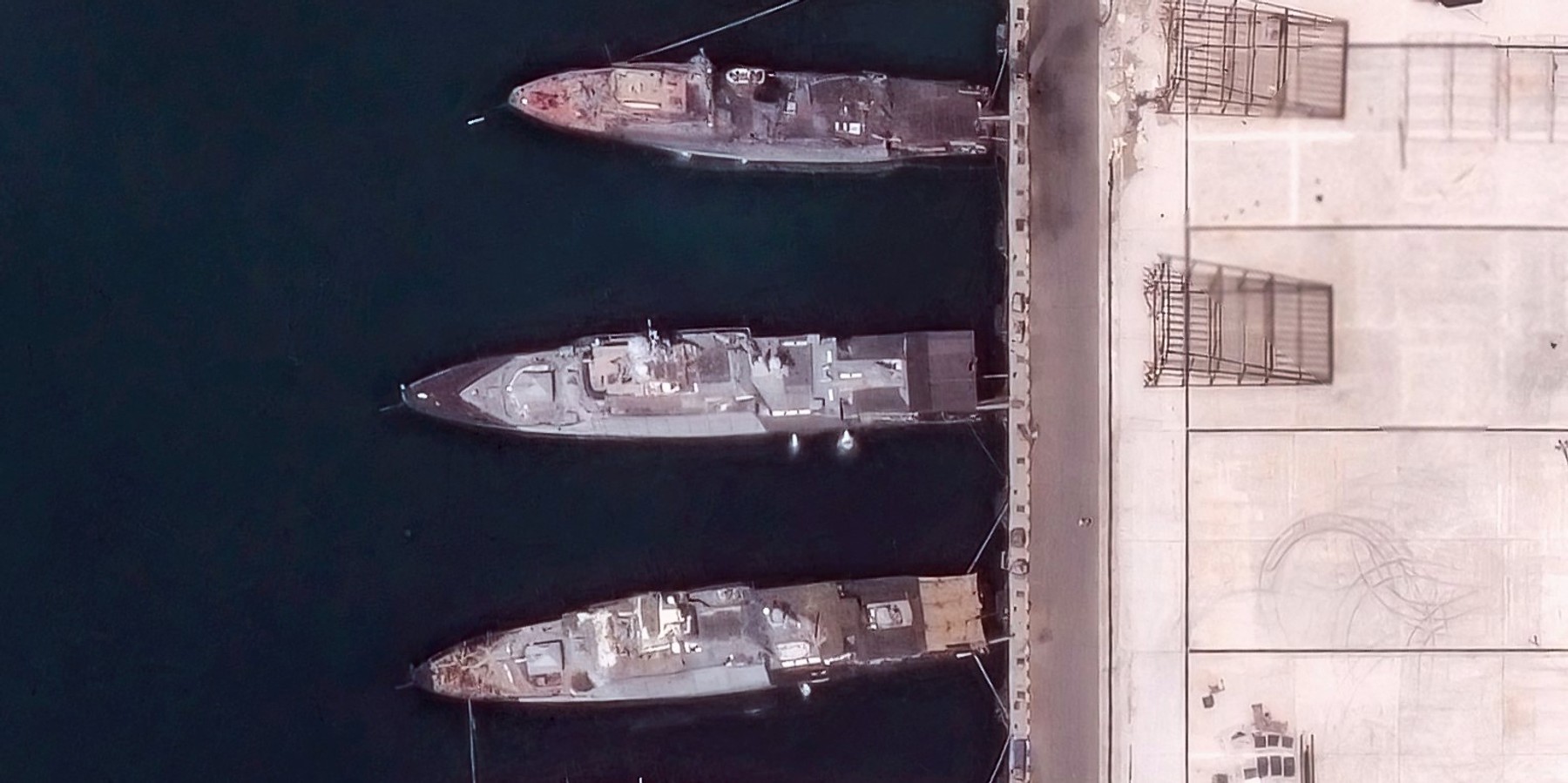 RUSSIA-UKRAINE-CONFLICT This handout satellite image taken and released by Vantor on August 12, 2026, shows heavily damaged ships at the Black Sea port naval base of Novorossiysk in Russia, following Ukrainian strikes. Ukraine's President said that Kyiv had "carried out a unique operation targeting the naval base in Novorossiysk - the last major stronghold of the Russian fleet in the Black Sea, more than 300 kilometres from the front line." Ukraine has increased its strikes on Russia in what it says is fair retribution for Moscow's own daily strikes on Ukrainian cities that force people into shelters and kill civilians across the country. (Photo by Satellite image ©2026 Vantor / AFP via Getty Images)