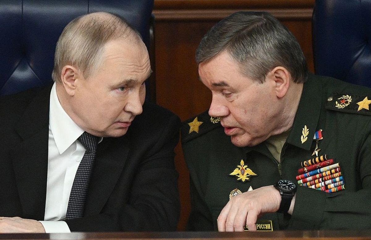 Russian President Vladimir Putin in a serious conversation with a leading member of the Russian military.