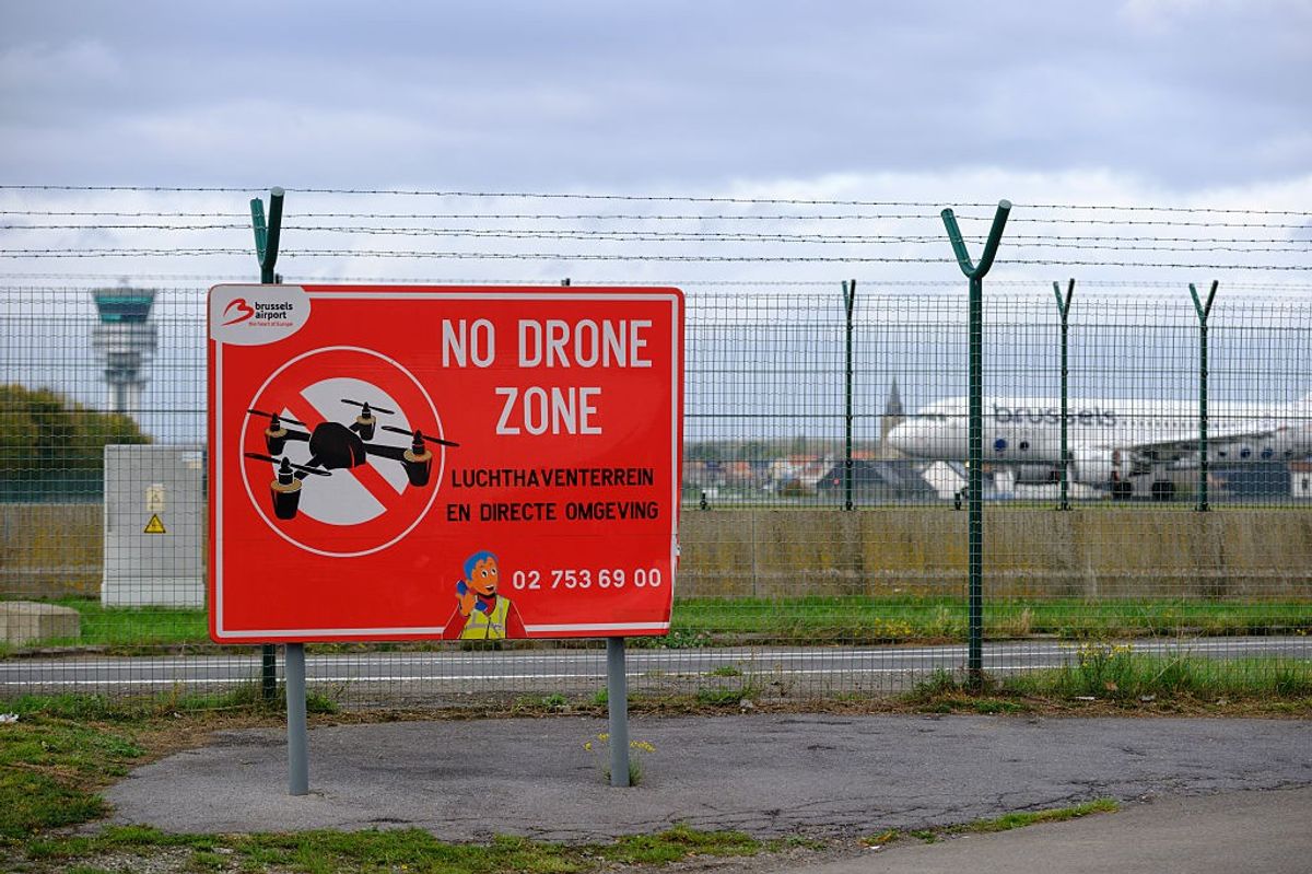 Signs that read 'No Drone Zone' are placed around the Brussels-National Airport on October 21, 2025 in Steenokkerzeel, Belgium.