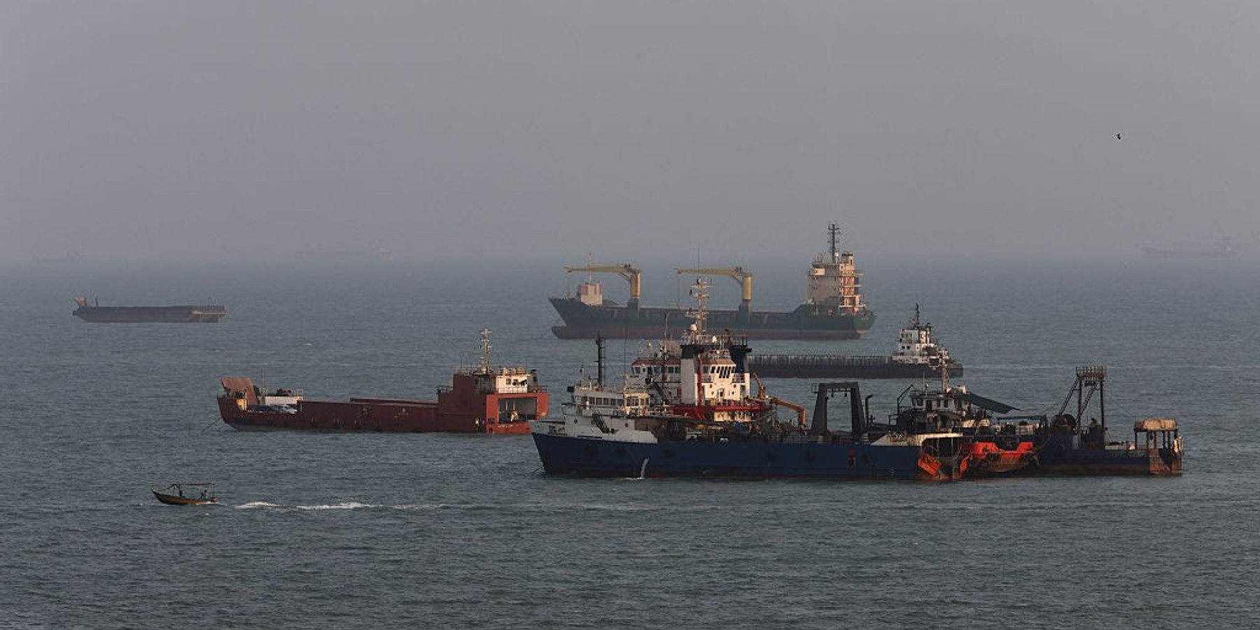 Strait Of Hormuz Remains Effectively Closed As Iran Makes New Demands For Reopening Of Waterway BANDAR ABBAS, IRAN - AUGUST 10: Ships are anchored in the Strait of Hormuz on August 10, 2026 off the coast of Bandar Abbas, Iran. In a recent statement, Iran's Supreme National Security Council said the vital waterway would not reopen until the United States corrects its behavior, demanding that the U.S. end its war on Iran and compensate the country for war damage, among other conditions. Iran has largely halted vessel traffic through the strait with the threat of strikes; meanwhile, the U.S. has imposed a blockade on Iranian ports. (Photo by Ali Saeedi/Getty Images)
