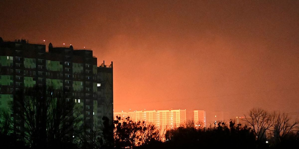 This photo shows shows the glow from explosions above Kyis during drone and missile strikes in Kyiv on November 14, 2025, amid the Russian invasion of Ukraine