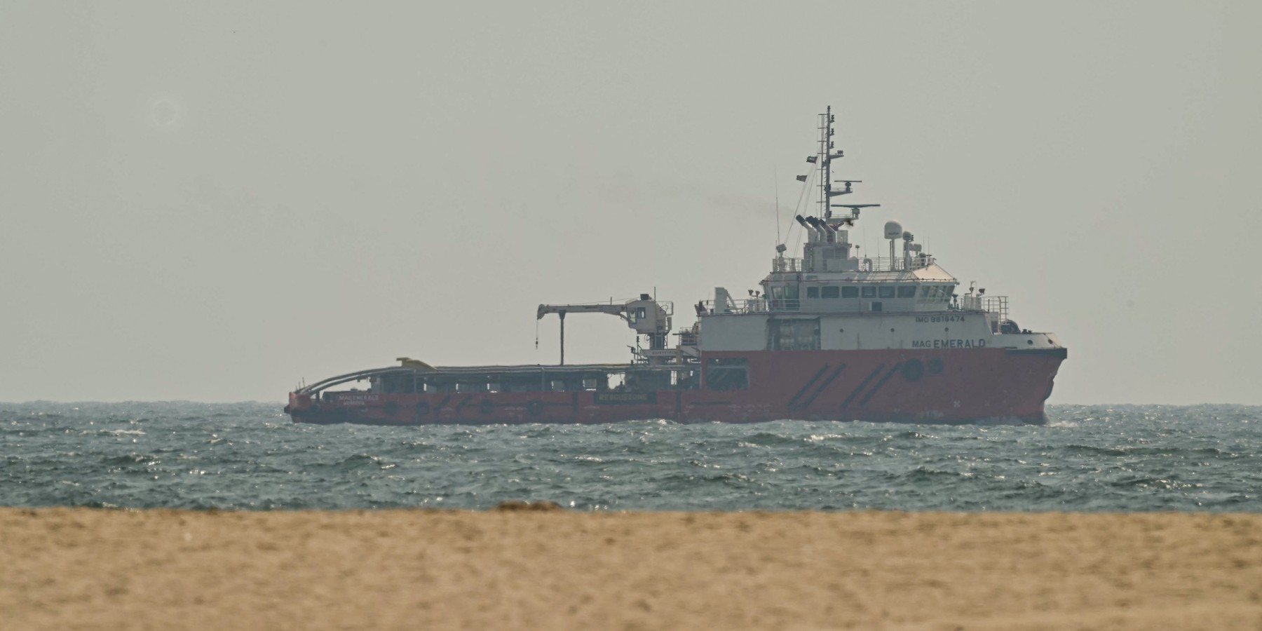 TOPSHOT-UAE-IRAN-US-ISRAEL-WAR TOPSHOT - A ship sails off the coast of Ajman on July 10, 2026. Traffic through the Strait of Hormuz has fallen sharply since July 8, especially through the UN-backed Omani route, analysts said, after vessels were attacked earlier this week and as the United States and Iran traded renewed strikes. (Photo by AFP via Getty Images) /