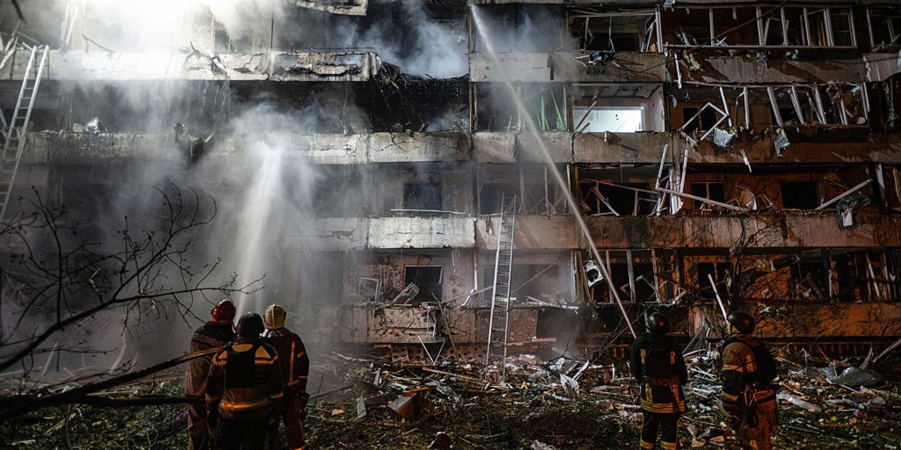 TOPSHOT-UKRAINE-RUSSIA-CONFLICT-WAR TOPSHOT - Ukrainian firefighters extinguish a blaze at the site of a Russian missile strike at an apartment building in Kyiv on October 14, 2026, amid the Russian invasion of Ukraine. (Photo by Genya SAVILOV / AFP via Getty Images)