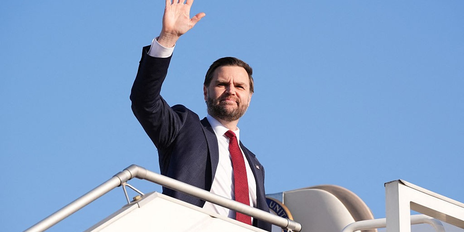 TOPSHOT - US Vice President JD Vance waves as he boards Air Force Two after attending talks on Iran in Islamabad on April 12, 2026. Iran and the United States failed to reach an agreement to end the war in the Middle East, US Vice President JD Vance said April 12 after marathon talks in Islamabad, adding that he was leaving negotiations after giving Tehran the "final and best offer". (Photo by Jacquelyn MARTIN / POOL / AFP via Getty Images)