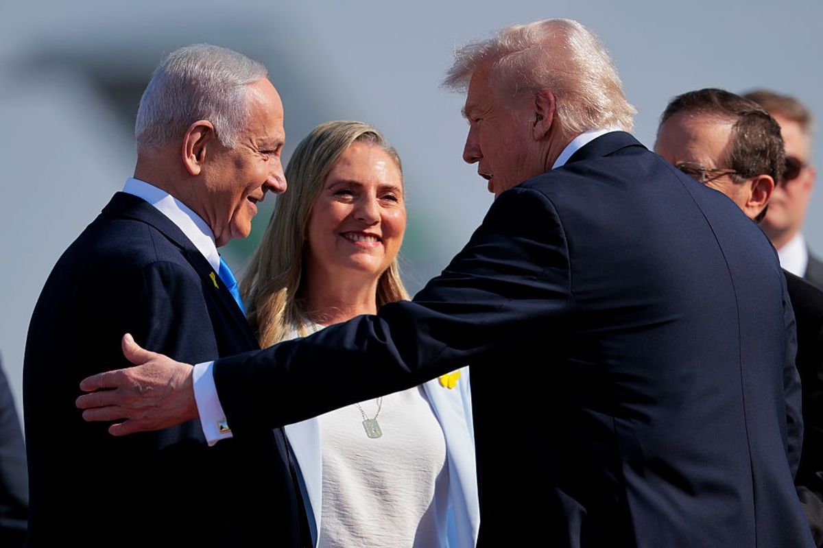 U.S. President Donald Trump (2R) is welcomed by Israeli Prime Minister Benjamin Netanyahu (L) at Ben Gurion International Airport on October 13, 2025 in Tel Aviv, Israel.