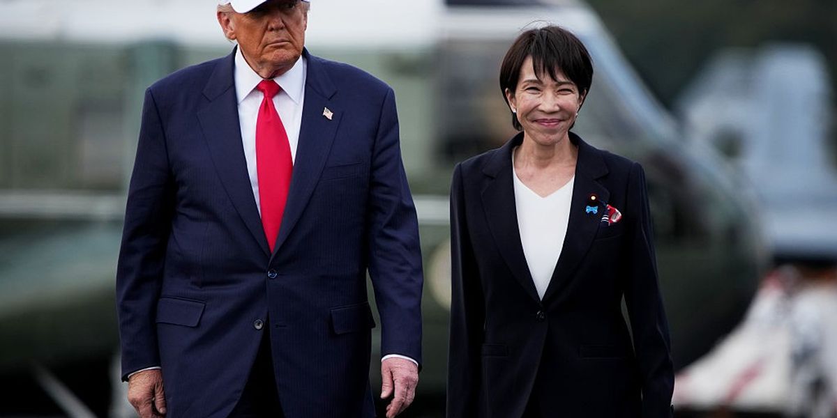 U.S. President Donald Trump and Japanese Prime Minister Sanae Takaichi arrive to speak to troops aboard USS George Washington at Fleet Activities Yokosuka on October 28, 2025 in Yokosuka, Japan.