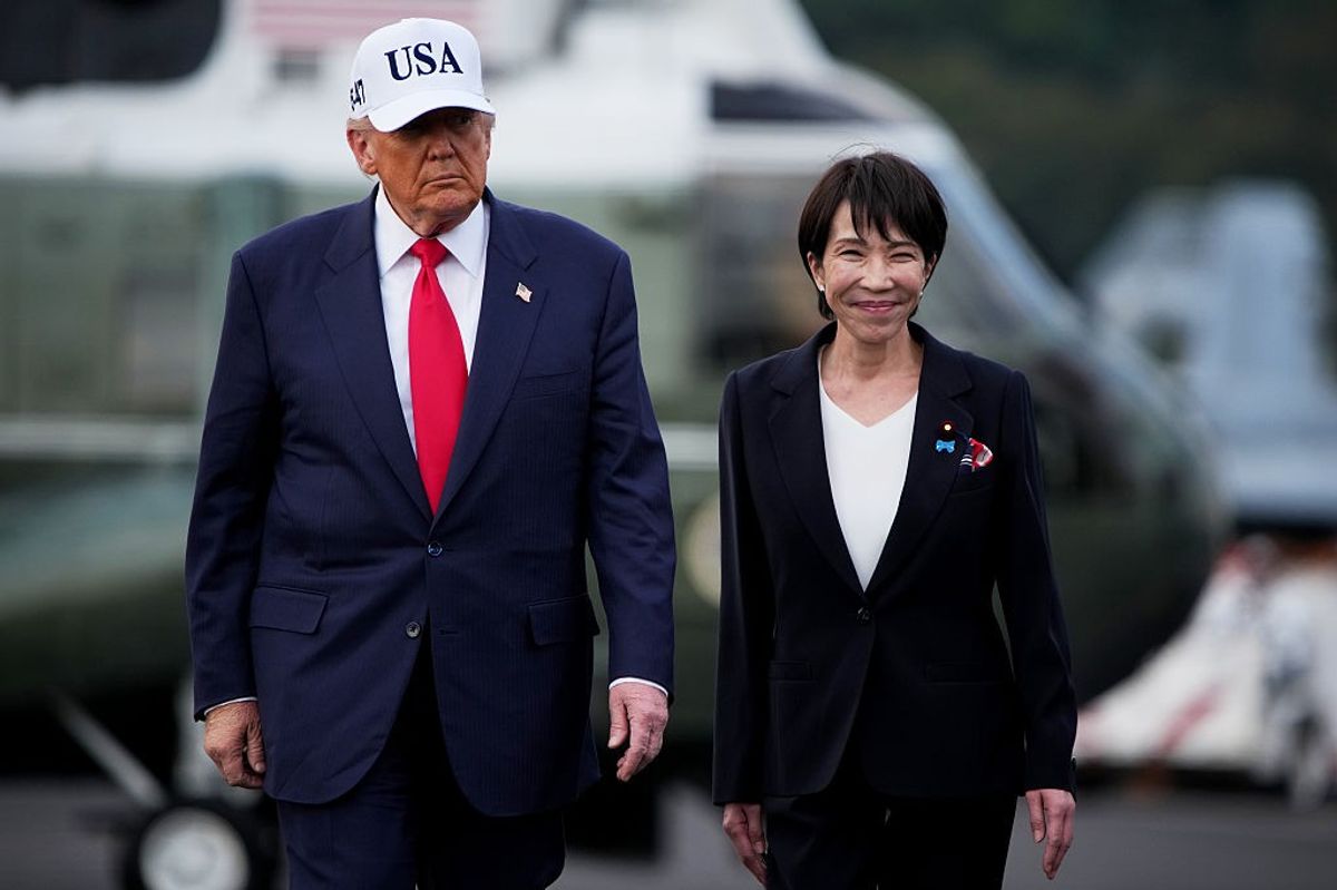 U.S. President Donald Trump and Japanese Prime Minister Sanae Takaichi arrive to speak to troops aboard USS George Washington at Fleet Activities Yokosuka on October 28, 2025 in Yokosuka, Japan.