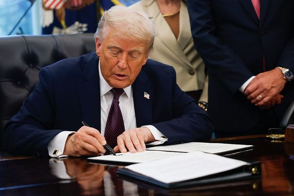 U.S. President Donald Trump signs a Presidential Memorandum in the Oval Office on September 15, 2025 in Washington, DC.