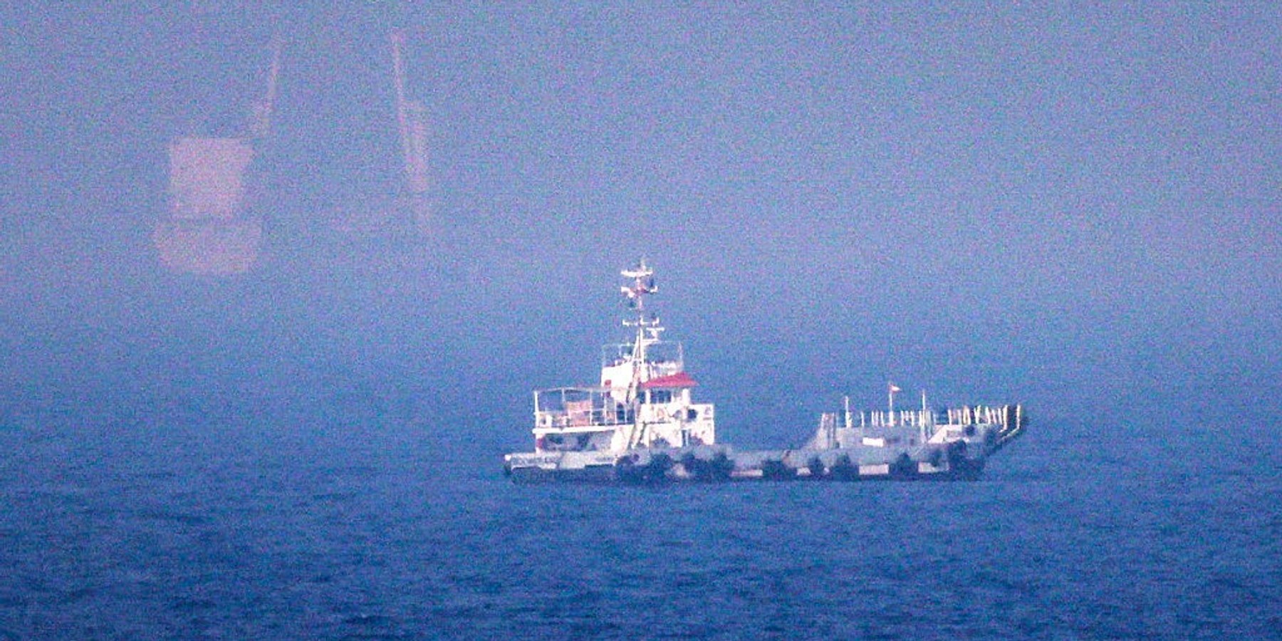 UAE-IRAN-US-ISRAEL-WAR This picture shows ships sailing near the Strait of Hormuz off the eastern coast of the United Arab Emirates at Khor Fakkan on July 13, 2026. The United States is "taking over" the Strait of Hormuz and will be paid for protecting it, US President Donald Trump declared on July 13, as Washington and Tehran once again fought over the vital waterway. (Photo by AFP via Getty Images) /