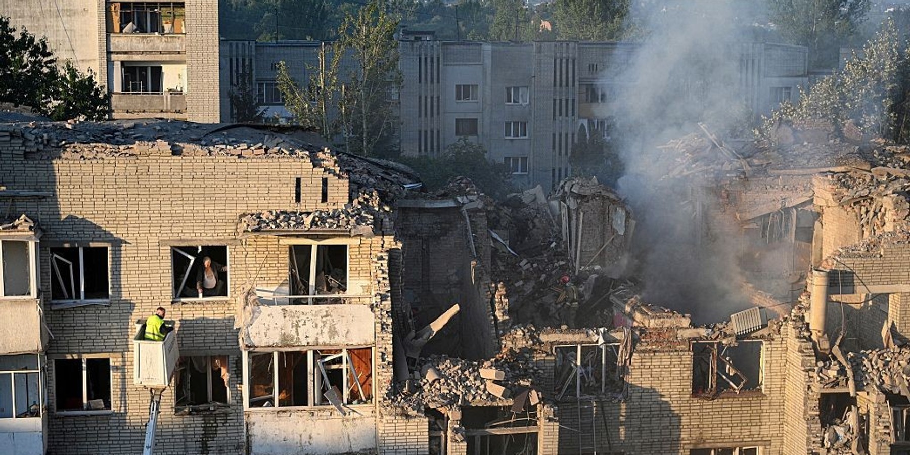 UKRAINE-RUSSIA-CONFLICT-WAR First responders operate at a residential building partially destroyed as a result of Russian missile strikes in the western Ukrainian city of Lviv on July 30, 2026, amid the Russian invasion in Ukraine. Officials in Ukraine's eastern Poltava region, meanwhile, said one person was killed in a drone strike on a warehouse, while at least 15 people were wounded in attacks on the western city of Lviv. Russia launched 74 missiles and 284 drones at Ukraine last night, according to Kyiv on July 30, 2026. (Photo by YURIY DYACHYSHYN / AFP via Getty Images)