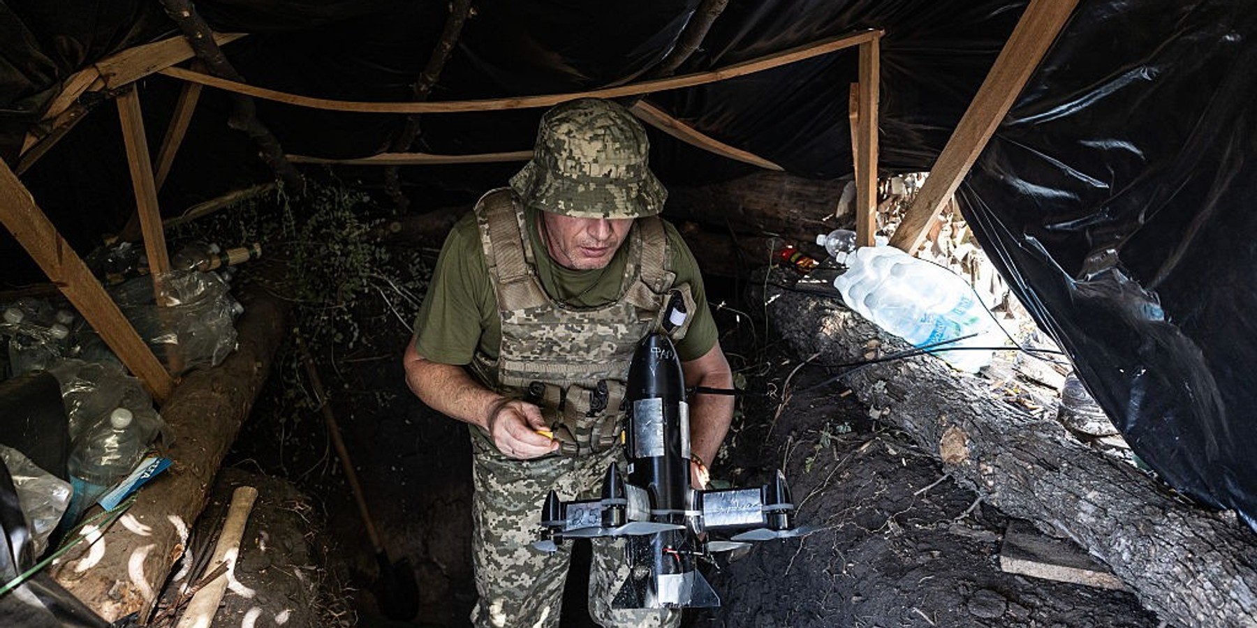 Ukrainian drone units are on duty at the front lines in Donetsk Region DONETSK REGION, UKRAINE - OCTOBER 8: A Ukrainian soldier carries a drone to attack enemy drones in the Donetsk region, Ukraine, 8 October 2026 (Photo by Diego Herrera Carcedo/Anadolu via Getty Images)