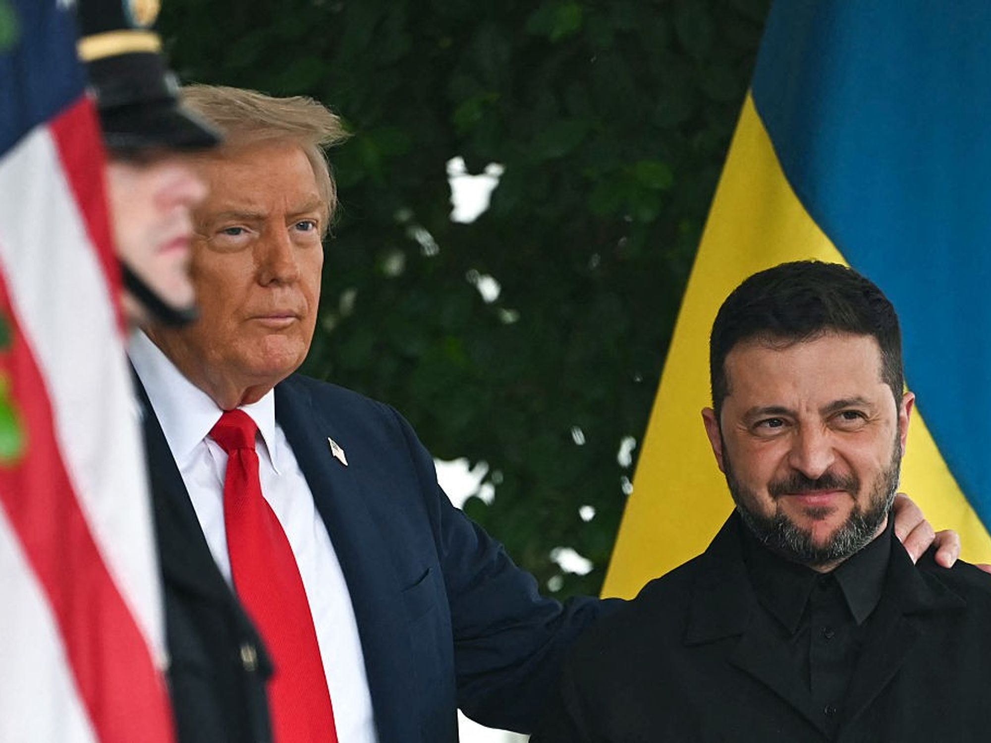 Ukrainian President Volodymyr Zelensky is greeted by US President Donald Trump (L) upon arrival at the White House West Wing in Washington, DC, on August 18, 2025.