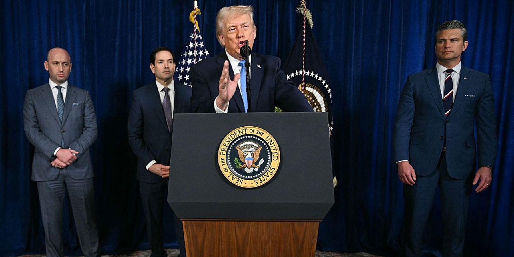 US President Donald Trump, alongside (L/R) Deputy Chief of Staff Stephen Miller, Secretary of State Marco Rubio, and US Secretary of Defense Pete Hegseth, speaks to the press following US military actions in Venezuela, at his Mar-a-Lago residence in Palm Beach, Florida, on January 3, 2026.