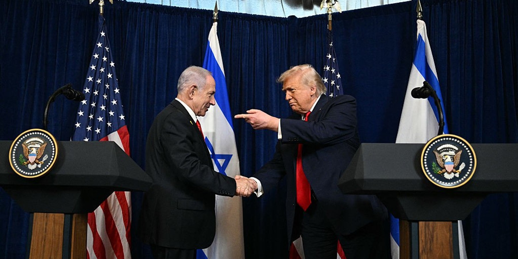 US President Donald Trump (R) and Israeli Prime Minister Benjamin Netanyahu arrive to speak to journalists during a joint press conference at Trump's Mar-a-Lago residence in Palm Beach, Florida, on December 29, 2025. US President Donald Trump hosted Israeli Prime Minister Benjamin Netanyahu in Florida on December 29 for crucial talks on moving to the next stage of the fragile Gaza truce plan.The two leaders also discussed Iran, with Trump saying that if Tehran rebuilt its nuclear facilities the United States would "knock them down." (Photo by Jim WATSON / AFP via Getty Images)