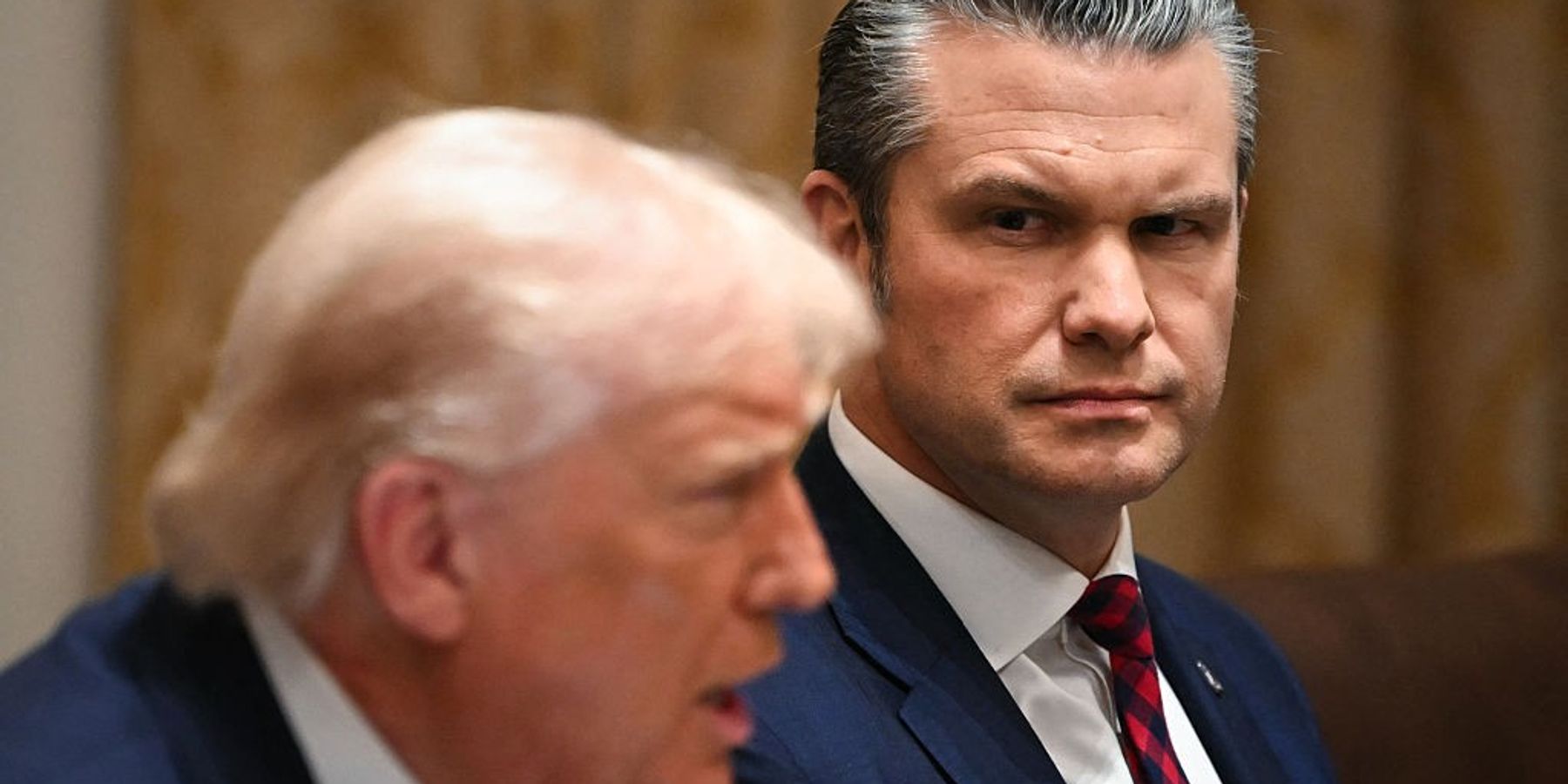 US President Donald Trump speaks alongside Secretary of Defense Pete Hegseth during a Cabinet Meeting in the Cabinet Room of the White House in Washington, DC on December 2, 2025.