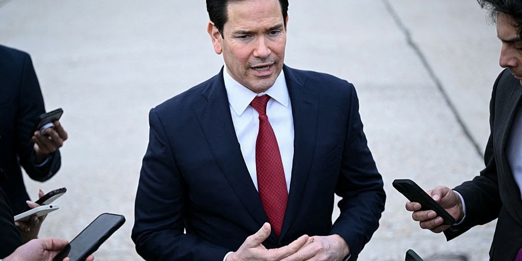 US Secretary of State Marco Rubio speaks to the press following a G7 Foreign Ministers' meeting with Partner Countries before his departure at the Bourget airport in Le Bourget, outside Paris, on March 27, 2026. Foreign ministers from the G7 will take part part in a two-day meeting with European nations and allies seeking to narrow differences with the US on the Middle East war while keeping other crises like Ukraine and Gaza high on the agenda. (Photo by Brendan SMIALOWSKI / POOL / AFP via Getty Images)