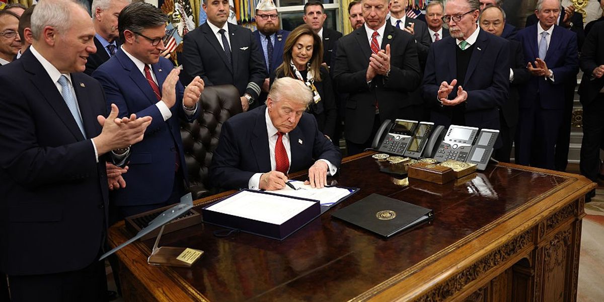 WASHINGTON, DC - NOVEMBER 12: U.S. President Donald Trump signs funding legislation to reopen the federal government as he is joined by House Minority Leader Steve Scalise (R-LA), House Speaker Mike Johnson (R-LA), Republican lawmakers and business leaders, during a ceremony in the Oval Office of the White House on November 12, 2025, in Washington, DC.