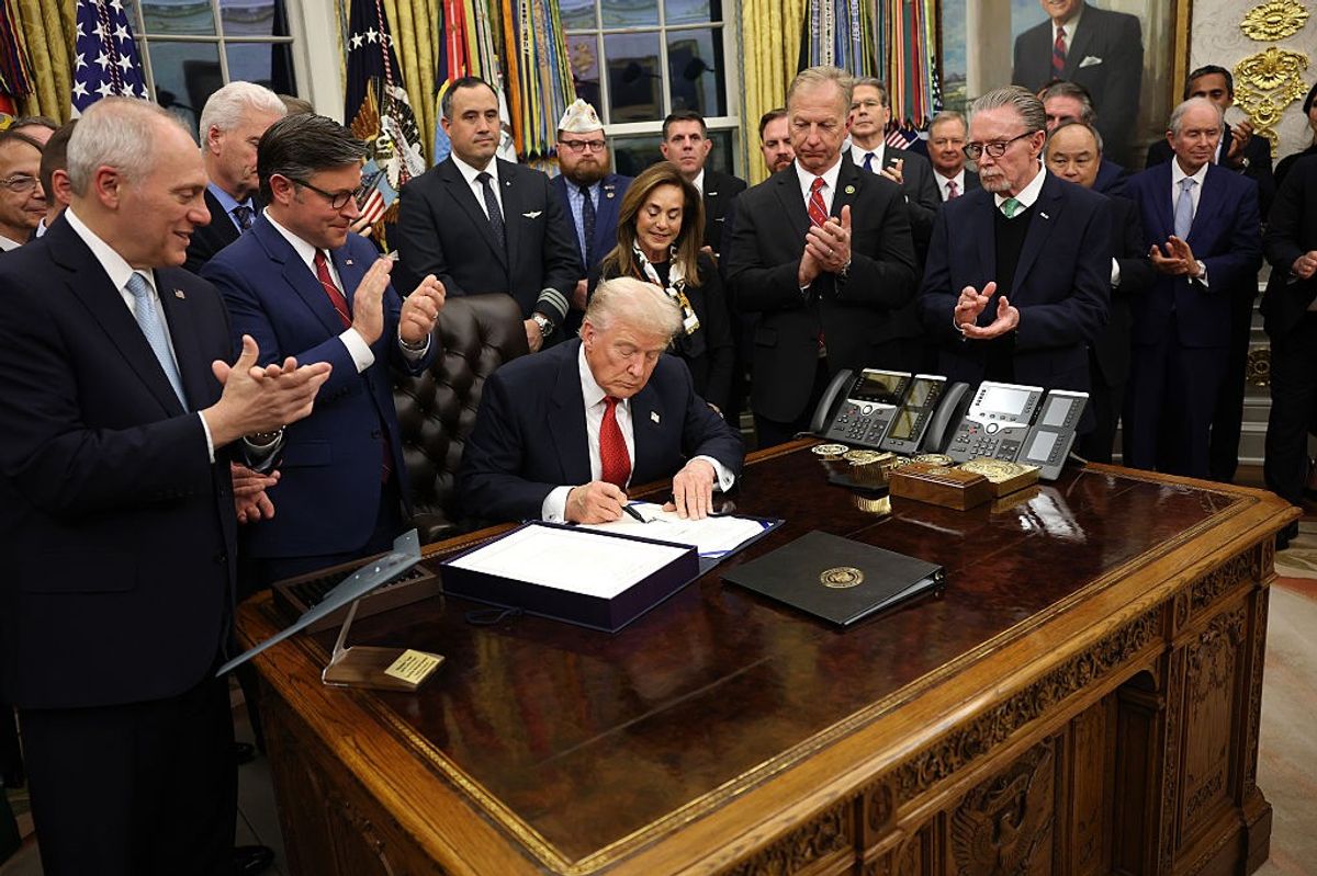 WASHINGTON, DC - NOVEMBER 12: U.S. President Donald Trump signs funding legislation to reopen the federal government as he is joined by House Minority Leader Steve Scalise (R-LA), House Speaker Mike Johnson (R-LA), Republican lawmakers and business leaders, during a ceremony in the Oval Office of the White House on November 12, 2025, in Washington, DC.