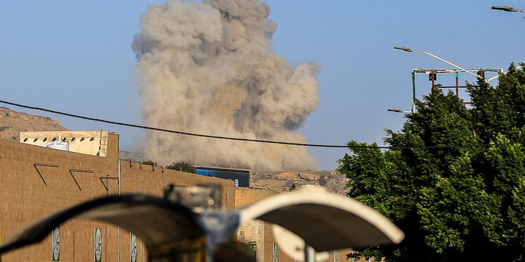 YEMEN-US-ISRAEL-IRAN-WAR A plume of smoke rises during a reported airstrike by the Saudi-led coalition on the Houthi-controlled Yemeni capital Sanaa, on October 9, 2026. The Houthis, who are fighting the Saudi-backed, internationally recognised government, seized the coastline alongside crucial trade route during a lightning offensive last month, extending their control over all of Yemen's Red Sea coast. Yemeni government forces have been attempting for several days to retake coastal territory captured by the pro-Iranian fighters. (Photo by AFP via Getty Images) /