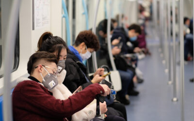 Chinese people wearing surgical mask sitting in subway