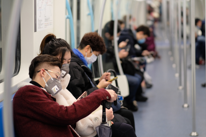 Chinese people wearing surgical mask sitting in subway